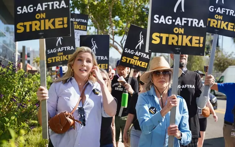 AG-AFTRA union on strike, Jane Fonda and June Diane in picket line near Sunset Bronson studios.