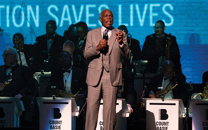 Danny Glover speaks on stage during Jazz Foundation of America benefit concert