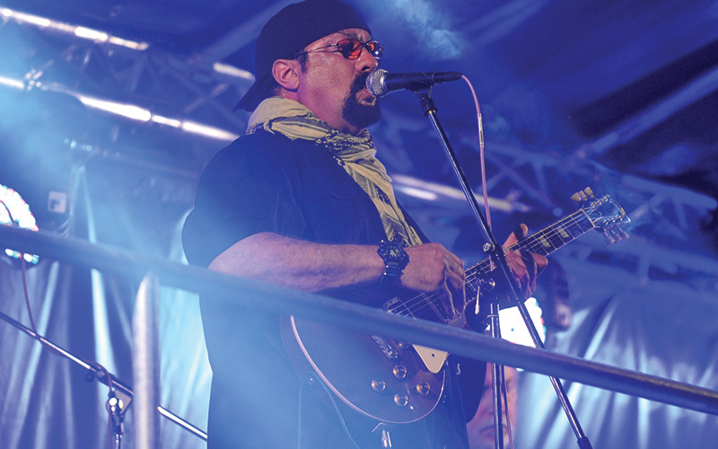Steven Seagal performs during the music festival Rock for People
